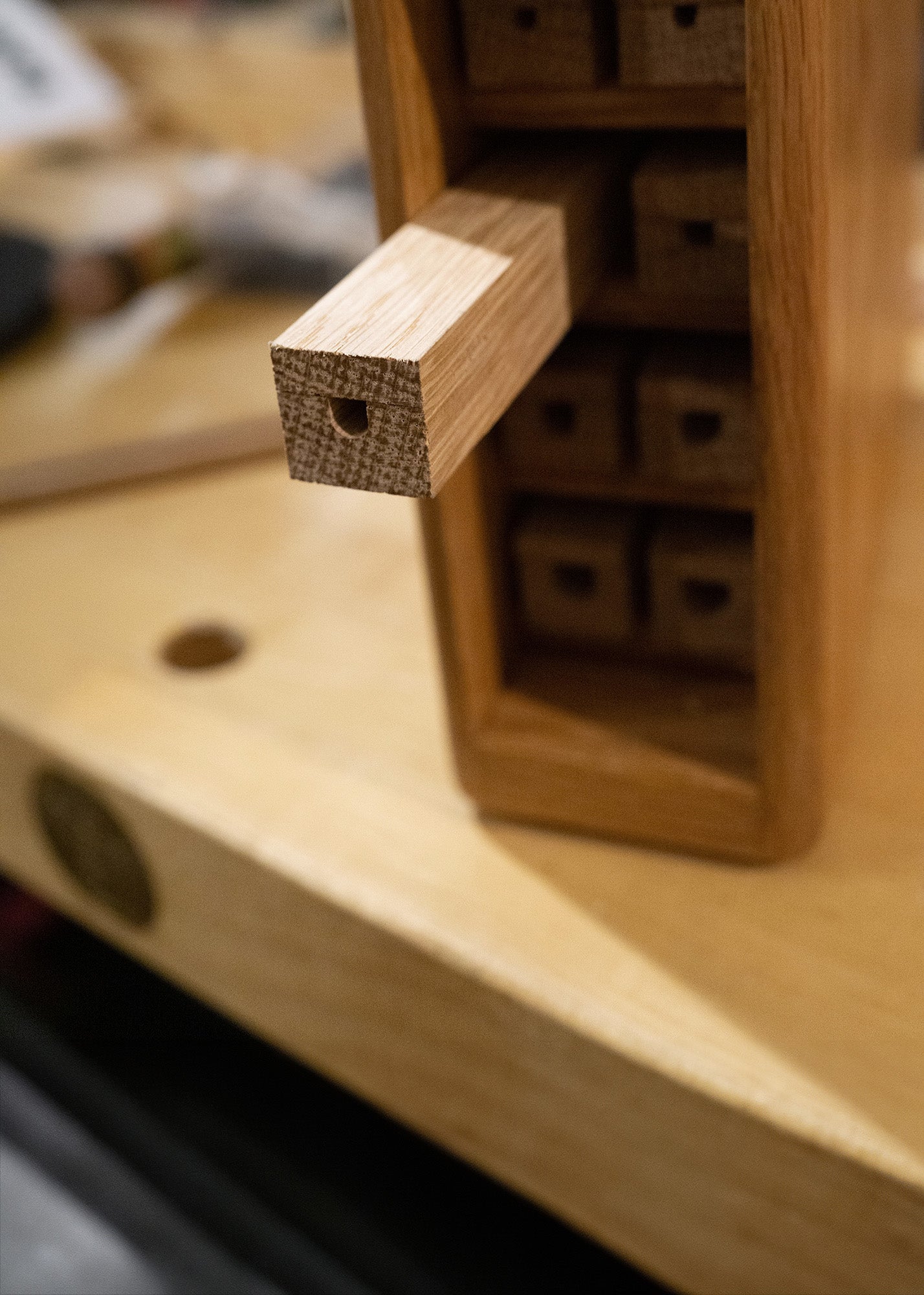 A bee home with a single nesting block partially removed